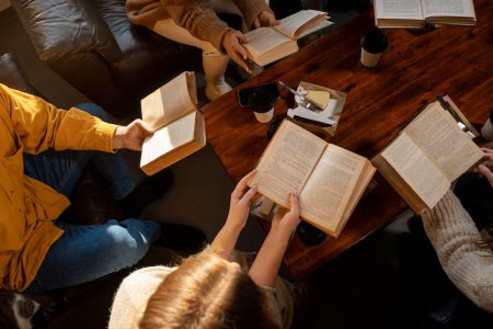 high-angle-people-reading-together_23-2150062128.jpeg